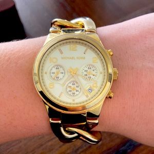 Gold link michael kors watch.